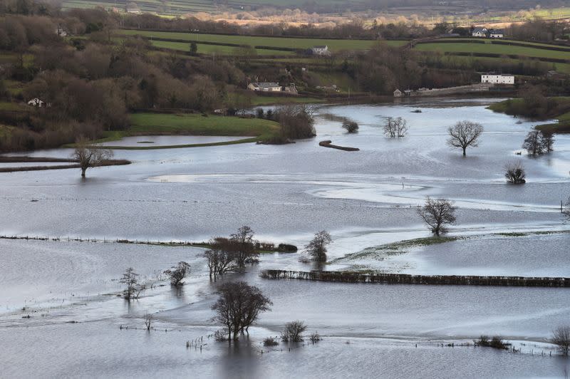 FILE PHOTO: Flooded fields are seen after Storm Christoph hit Wales bringing torrential rain and floods, near Carmarthen, Wales, Britain January 21, 2021.