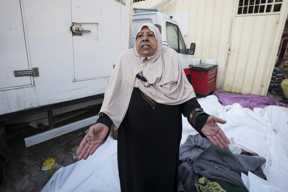 A Palestinian woman reacts to the bodies of relatives killed in the Israeli bombardment of the Gaza Strip outside a hospital in Deir al Ballah on Wednesday, June 5, 2024. (AP Photo/Abdel Kareem Hana)