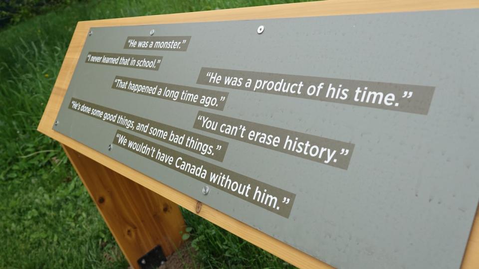 A panel in the orchard at Bellevue House shares a selection of common statements from visitors to the site, providing a window into the complicated legacy of Sir John A. Macdonald.