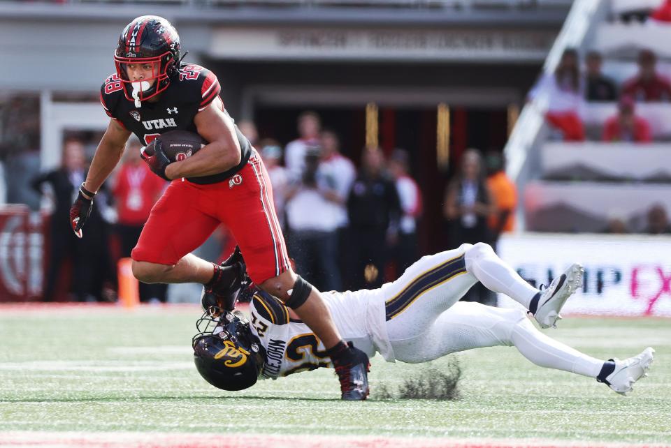 Utah Utes safety Sione Vaki (28) runs the wildcat against California Golden Bears defensive back Matthew Littlejohn (22) in Salt Lake City on Saturday, Oct. 14, 2023. | Jeffrey D. Allred, Deseret News