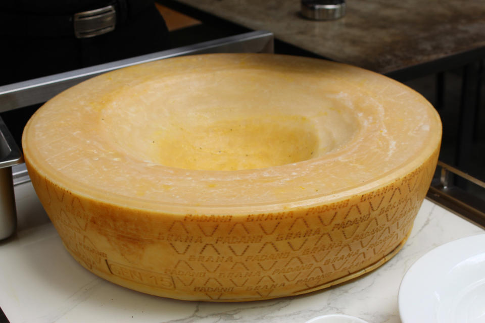 With a new cheese wheel menu, diners can now get salad, pasta and risotto that will be finished tableside in a wheel of Grana Padano cheese.  The cheese, which is from Italy, is aged for about 18 months before passing a strict quality test. (Photo: Yahoo Singapore)