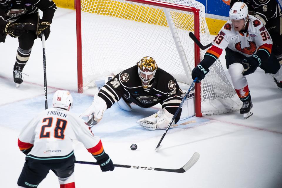 Hershey goalie Hunter Shepard dives before swiping the puck away from the net during the second period of Game 4 of the Calder Cup Finals against Coachella Valley at the Giant Center in Hershey, Pa., Thursday, June 15, 2023. The Bears won, 3-2, to even the series at two games apiece.