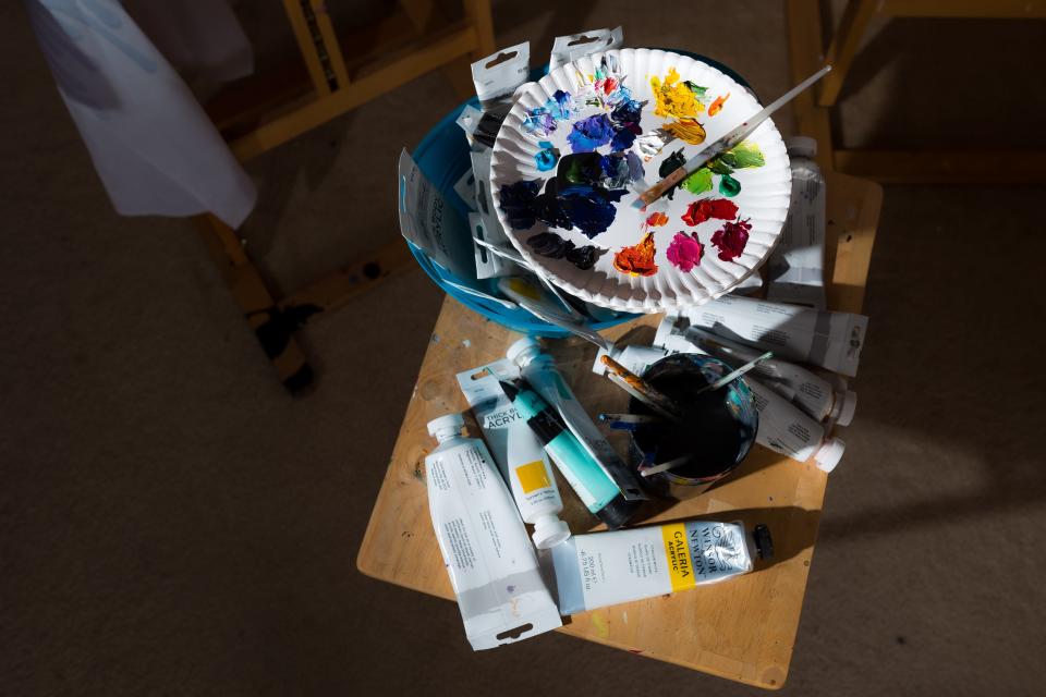 El Paso artist Blanca Estrada's painting materials as she works on a commissioned painting in her home studio in El Paso on Thursday, March 22, 2023.