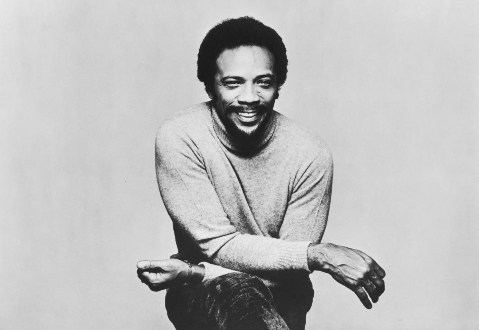 Quincy Jones in sweater.