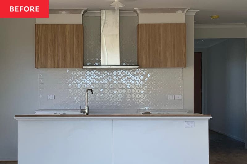 White tiles in kitchen before renovation.