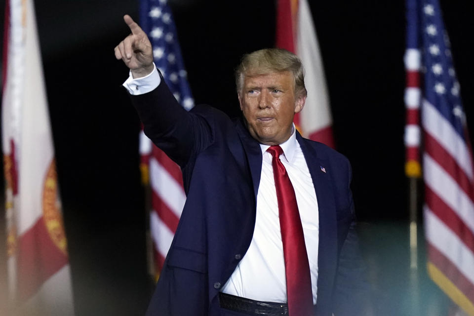 President Donald Trump gestures to supporters after speaking at a campaign rally in Pensacola, Fla., Friday, Oct. 23, 2020. (AP Photo/Gerald Herbert)