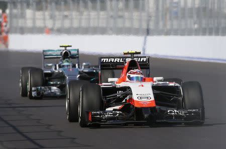 Marussia Formula One driver Max Chilton (R) of Britain and and Mercedes driver Nico Rosberg of Germany drive during the first free practice session of the Russian F1 Grand Prix at the Sochi Autodrom circuit October 10, 2014. REUTERS/Maxim Shemetov