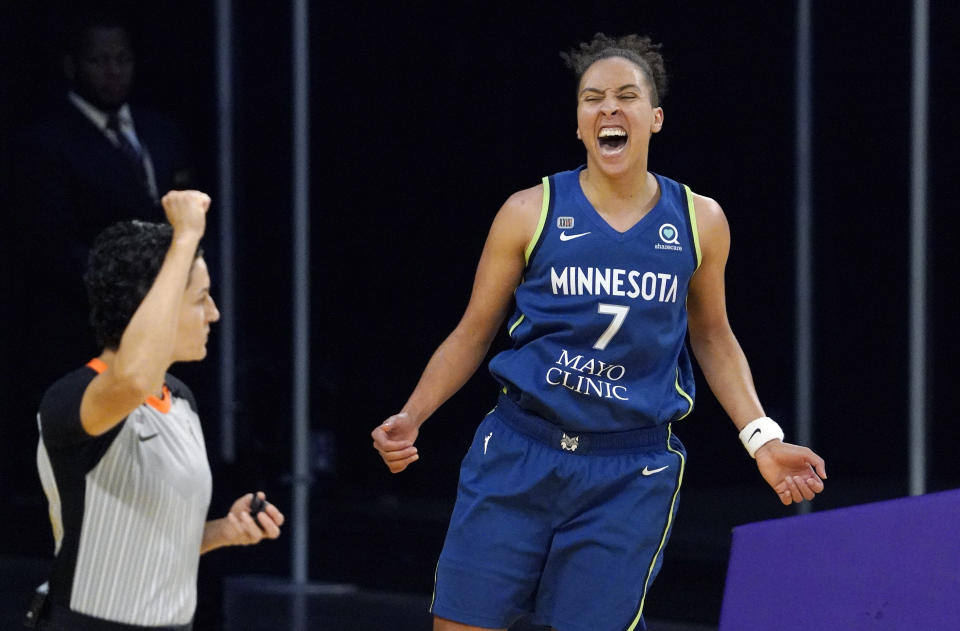 Minnesota Lynx guard Layshia Clarendon, right, celebrates after scoring and drawing a foul during the second half of a WNBA basketball game against the Los Angeles Sparks Sunday, July 11, 2021, in Los Angeles. The Lynx won 86-61. (AP Photo/Mark J. Terrill)