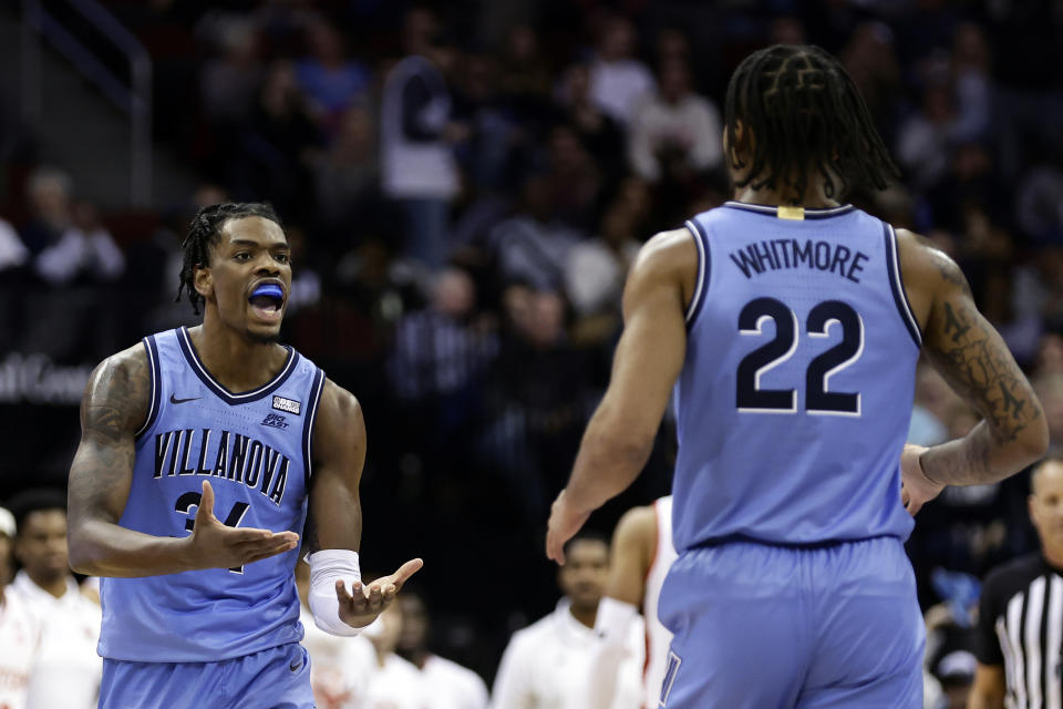 Villanova forward Brandon Slater, left, reacts toward Cam Whitemore (22) after a basket against Villanova during the second half of an NCAA college basketball game Saturday, Dec. 10, 2022, in Newark, N.J. (AP Photo/Adam Hunger)