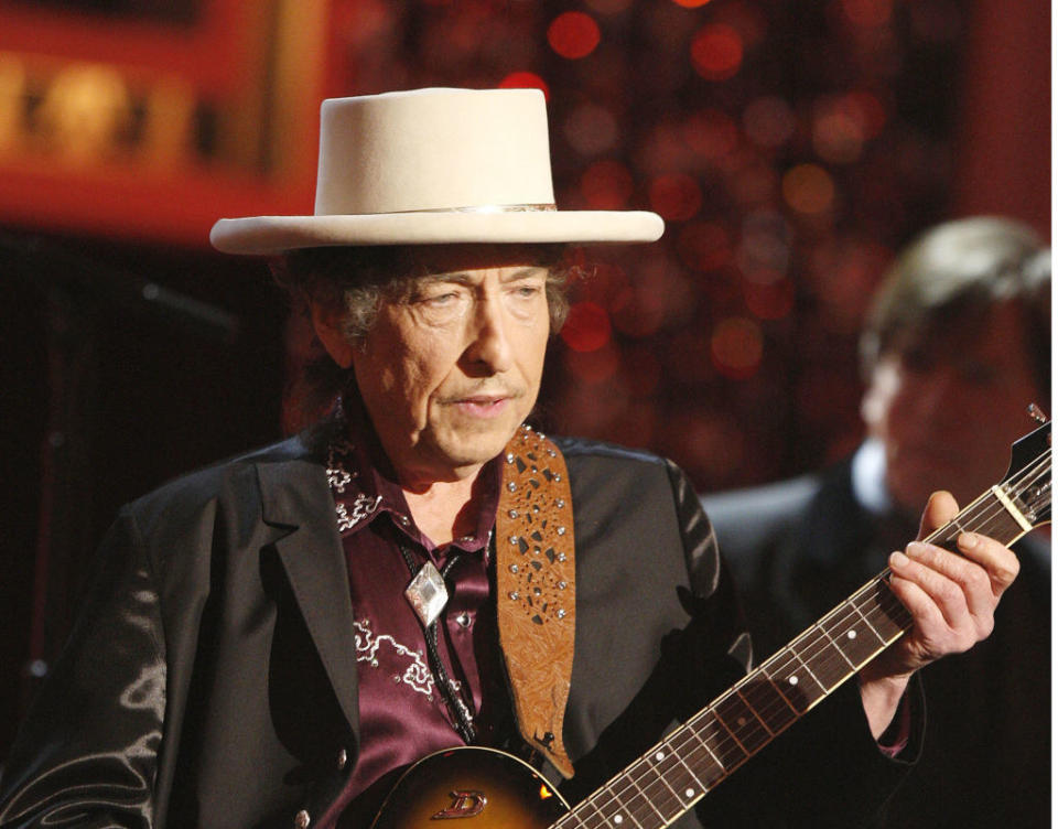 Bob Dylan playing guitar