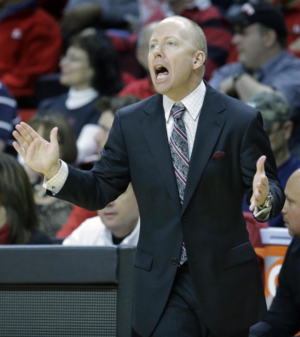 Cincinnati head coach Mick Cronin shouts to his players during the first half of an NCAA college basketball game against Rutgers Saturday, March 8, 2014, in Piscataway, N.J. Cincinnati won 70-66. (AP Photo/Mel Evans)