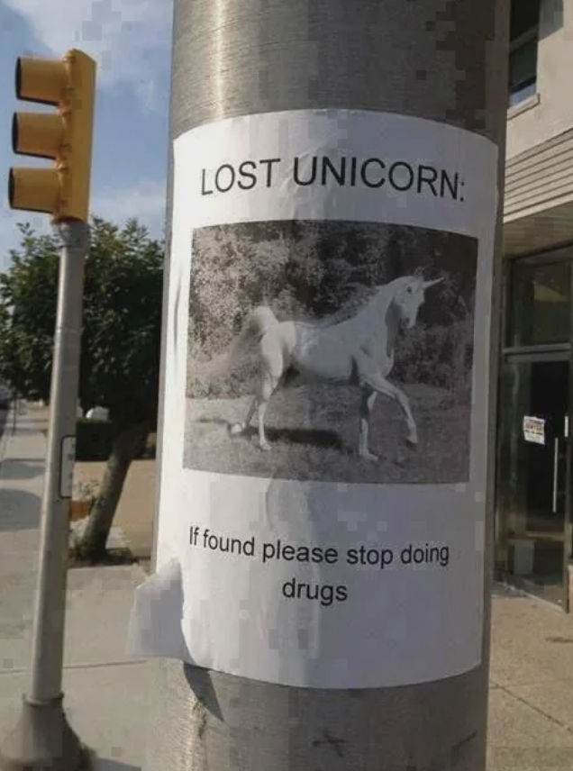 Lost unicorn poster on a pole: "If found please stop doing drugs" written below an image of a unicorn