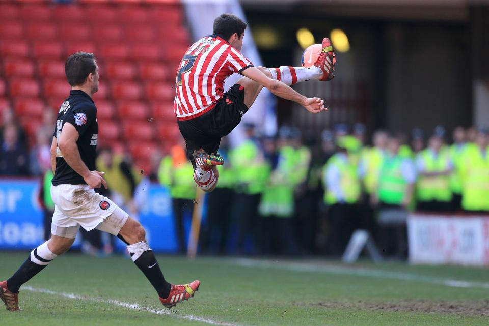 Sheffield United's Ryan Flynn scores their first goal of the game against Charlton Athletic during the FA Cup Sixth Round match at Bramall Lane, Sheffield, England, Sunday March 9, 2014. (AP Photo/Nick Potts, PA) UNITED KINGDOM OUT - NO SALES - NO ARCHIVES