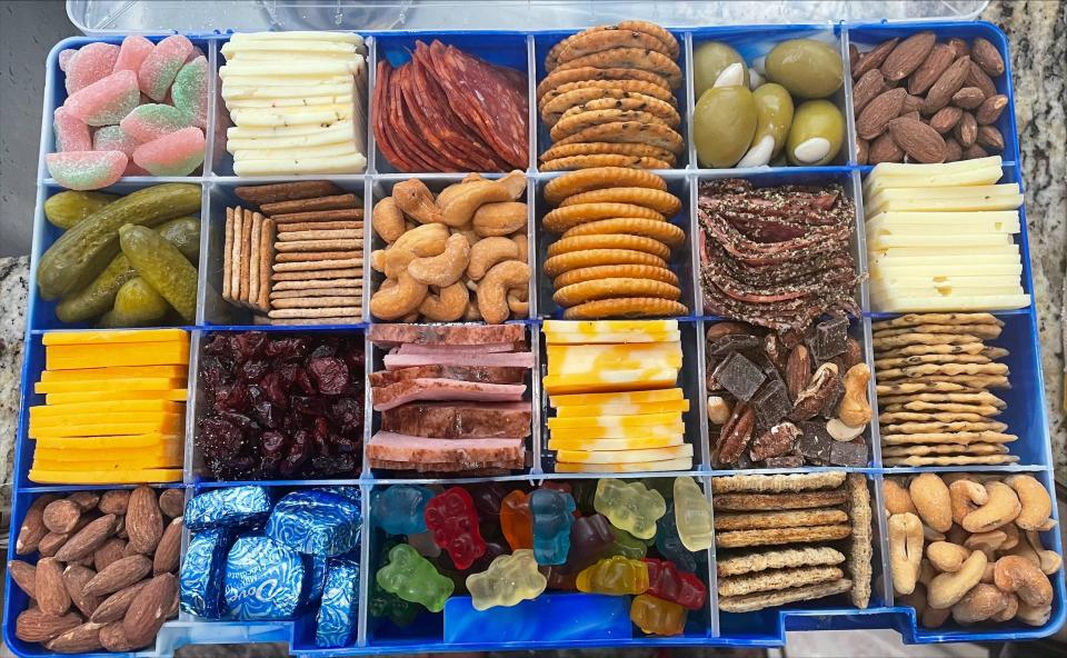 Lisa Wingate of Mobile, Alabama knows how to pack a cooler, which included this homemade charcuterie tackle box for a day in the sun during the Blue Angels Pensacola Beach air show on Saturday, July 9, 2022.