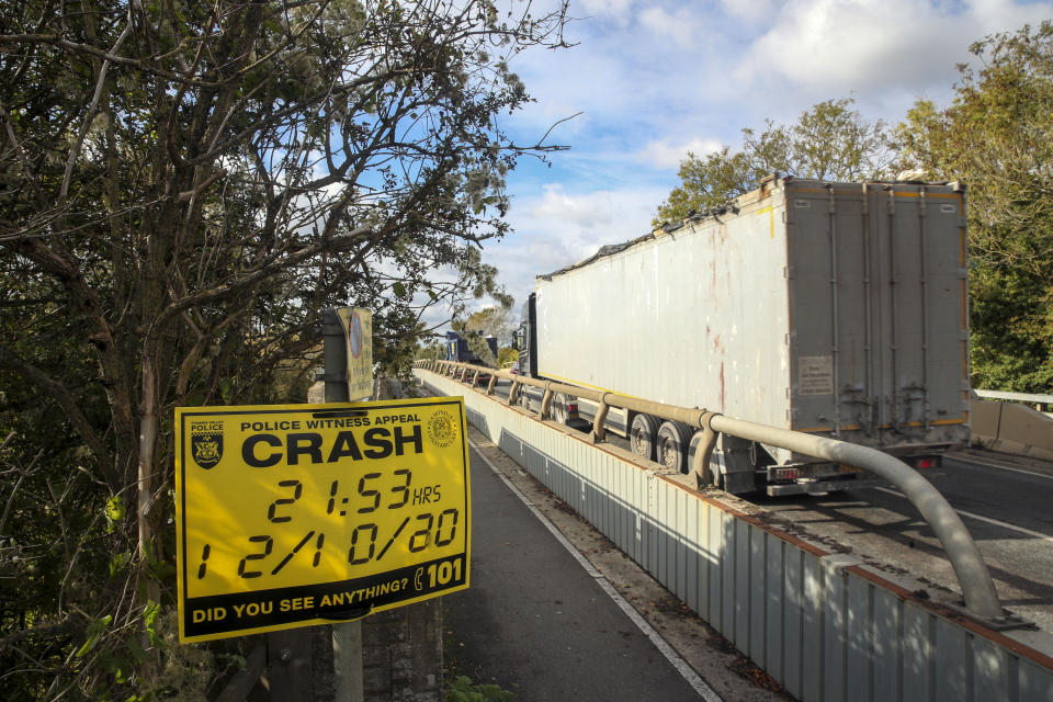 A police witness appeal sign on the A40 near Oxford where a four-year-old girl, a six-year-old boy, an eight-year-old girl and a 29-year-old woman from Chinnor, Oxfordshire, died Monday night after a collision between a people carrier and a heavy goods vehicle.