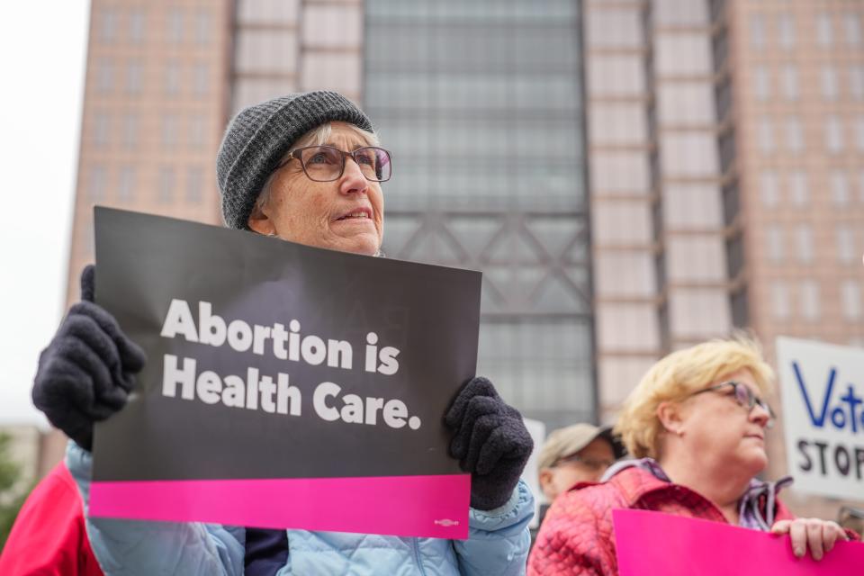 Laura Mather stands in support for abortion rights during the rally in front of the Ohio Statehouse in Columbus on Oct. 8, 2023.