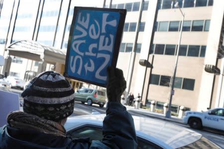 FILE PHOTO: Net neutrality advocates rally in front of the Federal Communications Commission (FCC) ahead of Thursday's expected FCC vote repealing so-called net neutrality rules in Washington, U.S., December 13, 2017. REUTERS/Yuri Gripas