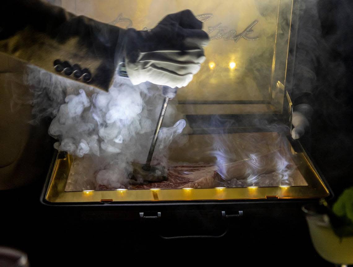 Papi Steak Restaurant in Miami Beach serves a $1,000 Wagyu tomahawk steak that is presented to the table in a briefcase. One of the waiters brands the steak at the table during the presentation.