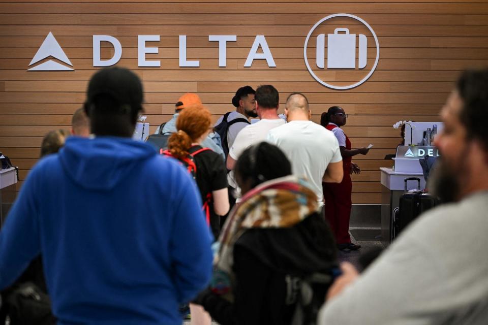 PHOTO: People searching for missing luggage wait in line to speak with a Delta Air Lines baggage handler at the Delta Air Lines baggage claim area at Los Angeles International Airport (LAX), July 24, 2024, in Los Angeles. (Patrick T. Fallon/AFP via Getty Images)