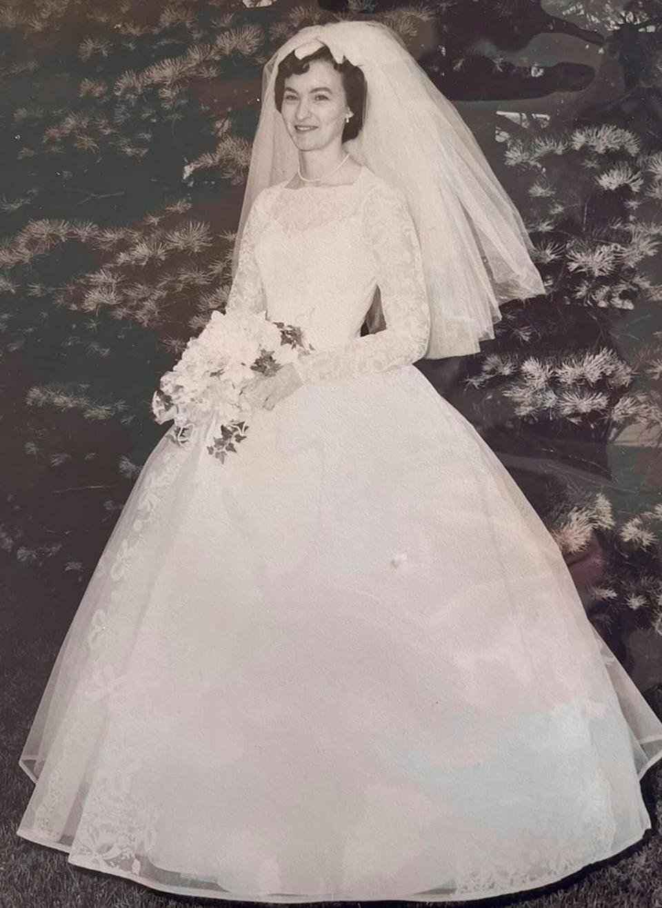 MERCURY PRESS (PICTURED Anne Cooke wearing the dress in 1961) This woman has something borrowed and something old as she walked down the aisle wearing her grandma's 60-year-old wedding dress. Allie Livingwater, 23, tied the knot with Timothy, 27, on September 25 [2021] wearing her grandma Anne Cooke, 88, dress. The white laced gown was discovered in a black bin liner in 2016 and Allie immediately knew she wanted to wear it as 'something borrowed'. The long-sleeved dress required zero alterations but needed a clean after being stored in the basement since 1961. SEE MERCURY COPY