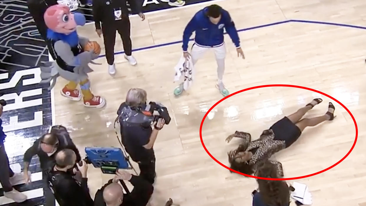 LA Clippers sideline reporter Kristina Pink took a hard fall after slipping on water thrown around during a post-game celebration. Picture: Bally Sports