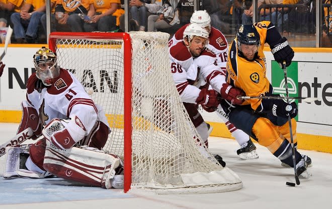   Antoine Vermette #50 Of The Phoenix Coyotes And Matt Halischuk #24 Fight For The Puck Behind Goalie Mike Smith #41 In Getty Images