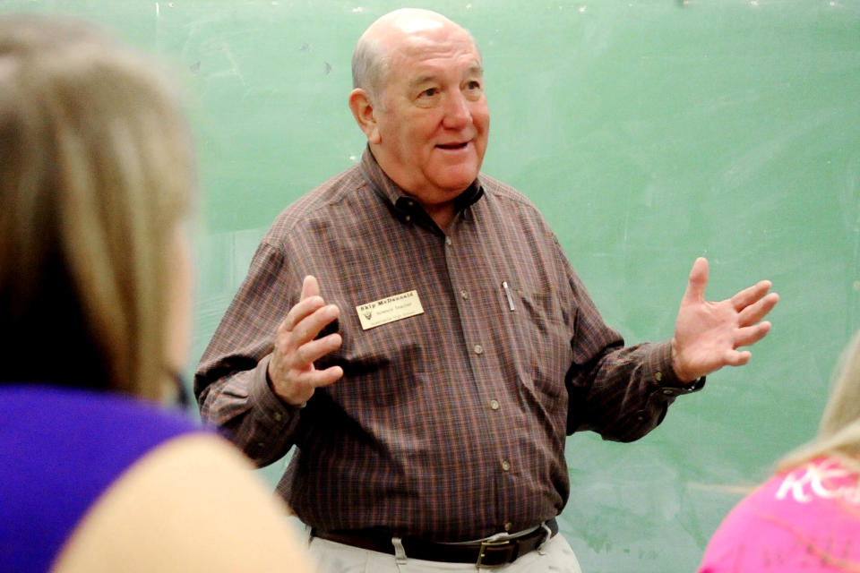 FILE- In this Nov. 5, 2010 file photo, volunteer teacher Dr. Skip McDannald makes a point to his class of students while teaching a lesson about the nervous system at Hawkinsville High School in Hawkinsville, Ga. Taylor Regional in the small town of Hawkinsville, Georgia, had gone through years of financial troubles before it approached retired Dr. Skip McDannald for help in 2015. (Woody Marshall/The Macon Telegraph via AP, File)