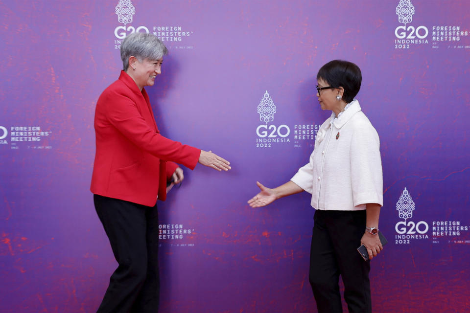 Australia's Foreign Minister Penny Wong, left, meets Indonesia's Foreign Minister Retno Marsudi at the G20 Foreign Ministers' Meeting in Nusa Dua, Bali, Indonesia Friday, July 8, 2022. (Willy Kurniawan/Pool Photo via AP)