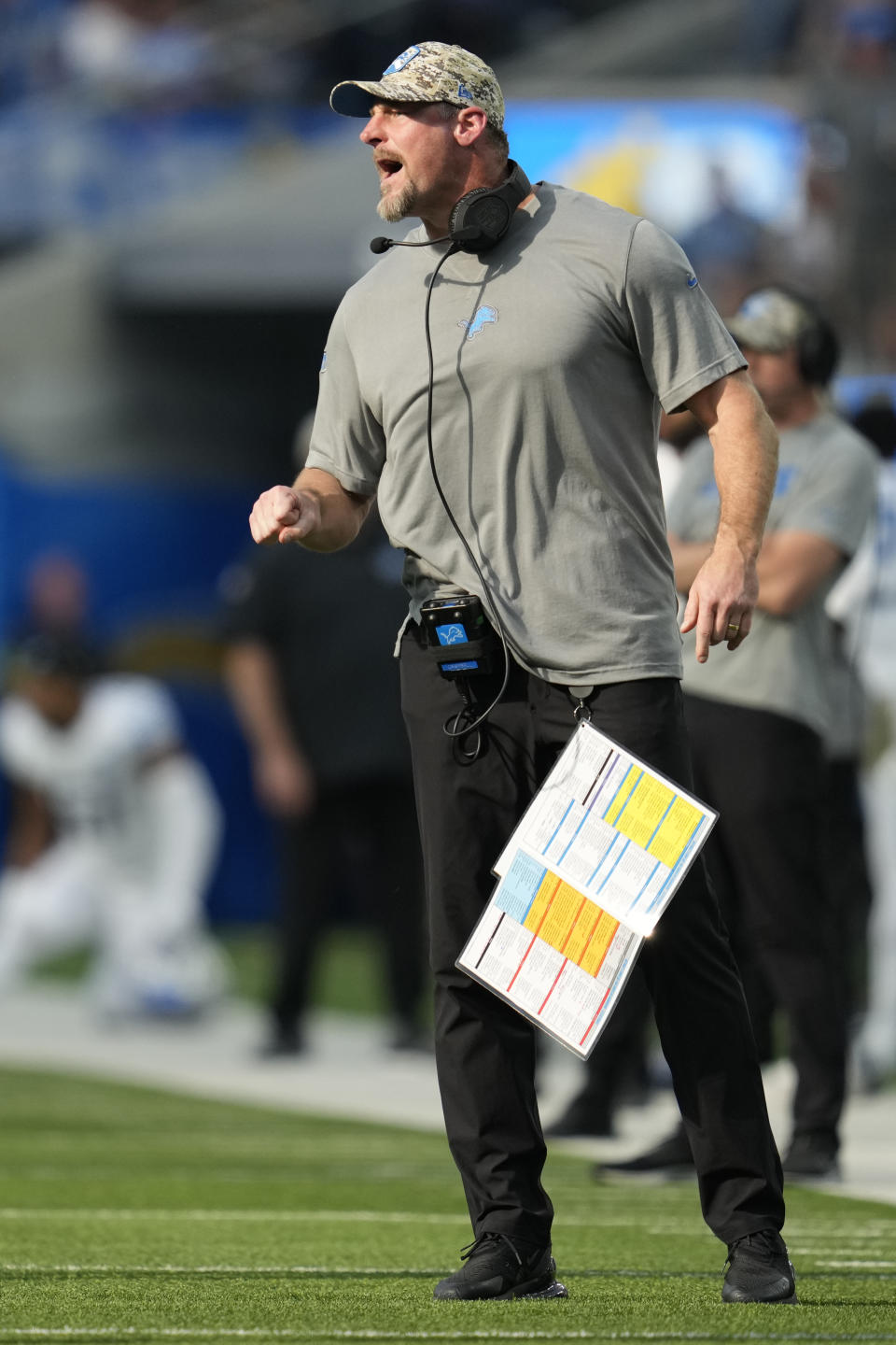 CORRECTS TO DETROIT LIONS HEAD COACH DAN CAMPBELL NOT LOS ANGELES CHARGERS HEAD COACH DAN CAMPBELL - Detroit Lions head coach Dan Campbell calls a play during the first half an NFL football game against the Los Angeles Chargers, Sunday, Nov. 12, 2023, in Inglewood, Calif. (AP Photo/Ashley Landis)