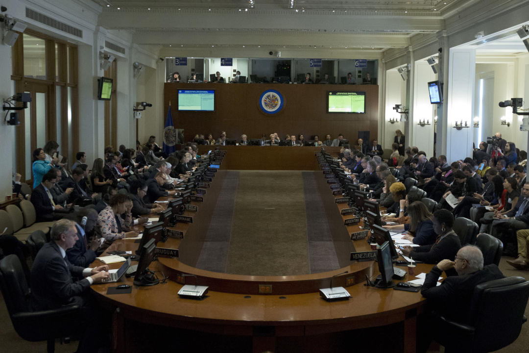 Permanent Council of the Organization of American States (OAS) representatives listen during the special meeting to consider the 
