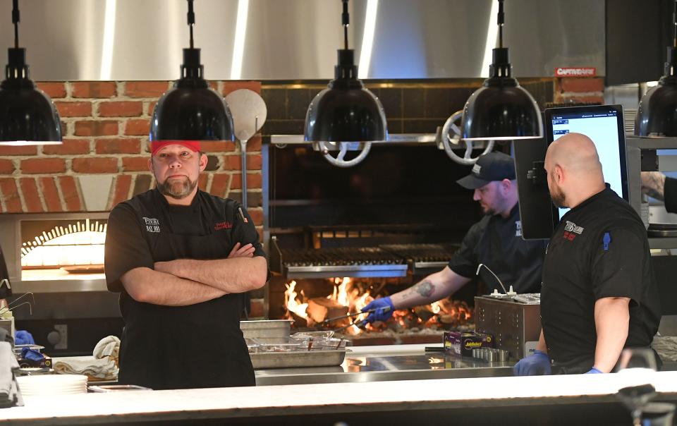 Executive chef Peter Clark, at left, and sous chef John Basio, at right, man the kitchen area of the Bay House Oyster Bar & Restaurant, 6 Sassafras Pier on Erie's bayfront, on the opening night for the restaurant.