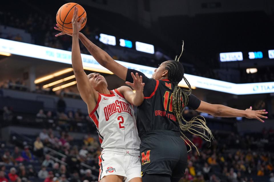Maryland's Jakia Brown-Turner  blocks a shot attempt by Ohio State's Taylor Thierry on Friday.