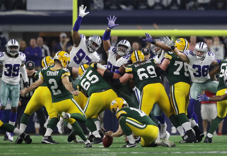 <p>Mason Crosby #2 of the Green Bay Packers kicks the game winning field goal as time expires against the Dallas Cowboys in the NFC Divisional Playoff game at AT&T Stadium on January 15, 2017 in Arlington, Texas. (Photo by Ronald Martinez/Getty Images) </p>