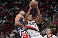Portland Trail Blazers guard CJ McCollum (3) drives to the basket as Houston Rockets guard Eric Gordon defends during the first half of an NBA basketball game, Friday, Jan. 28, 2022, in Houston. (AP Photo/Eric Christian Smith)