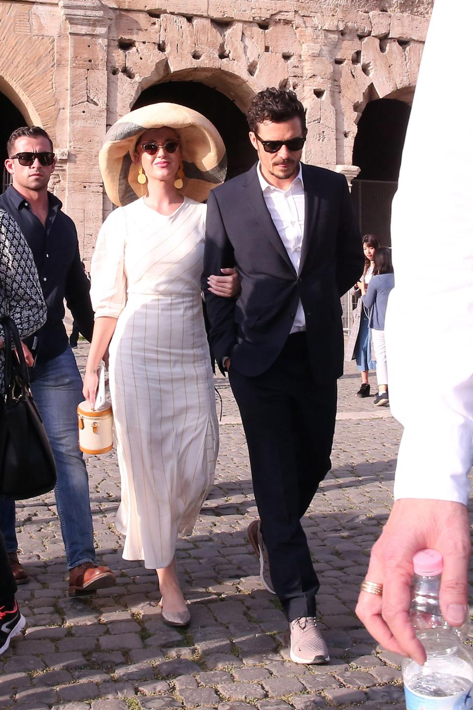The on-again couple sported complementary looks on a Roman holiday.