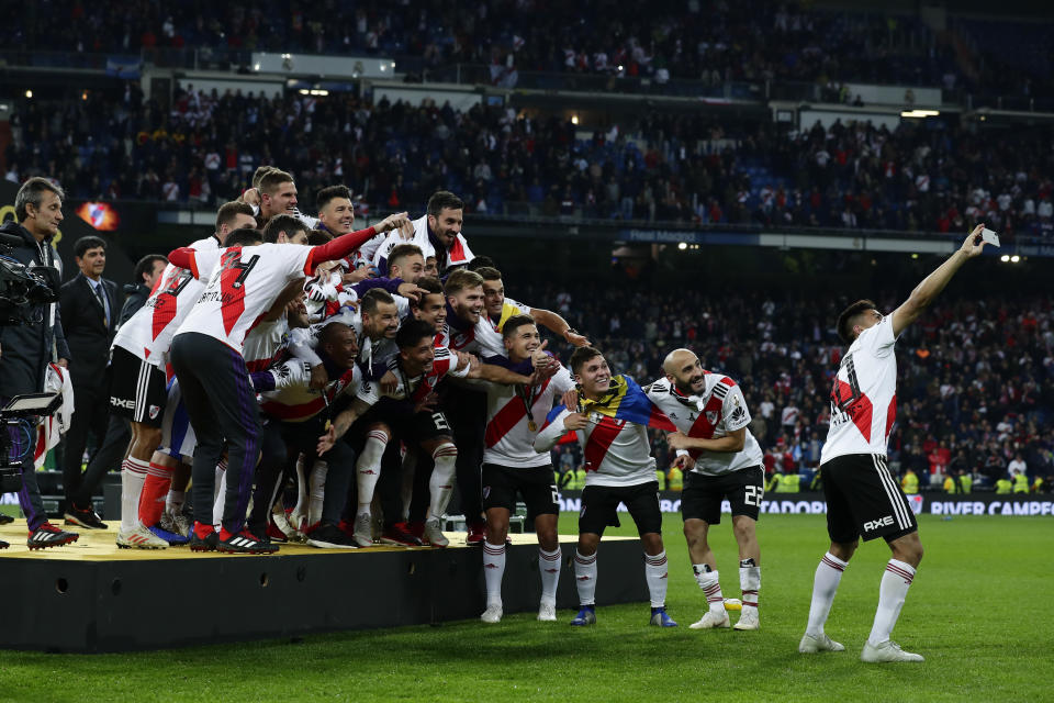 Gonzalo Martinez of Argentina's River Plate takes a selfie after beating 3-1 Argentina's Boca Juniors in the Copa Libertadores final soccer match at the Santiago Bernabeu stadium in Madrid, Spain, Sunday, Dec. 9, 2018. (AP Photo/Manu Fernandez)