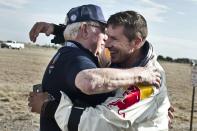 Pilot Felix Baumgartner of Austria hugs Capcom 1 USAF Col (ret) Joe Kittinger of the United States during the second manned test flight for Red Bull Stratos in Roswell, New Mexico, USA on July 25, 2012.Â Red Bull Stratos is a mission to the edge of space to an altitude of 37.000 meters to break several records including the sound of speed in freefall. (Photo courtesy of Red Bull Stratos)