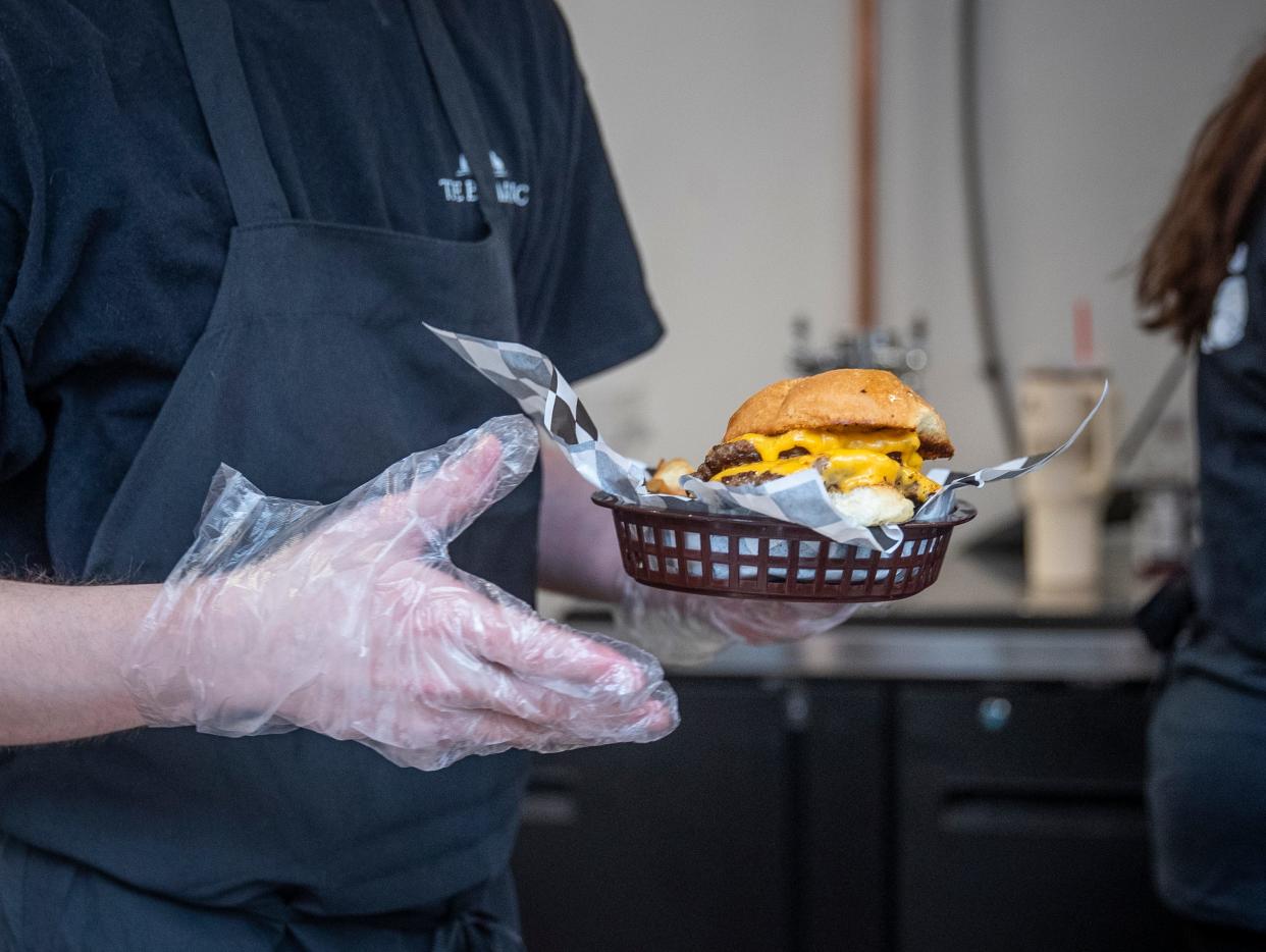 The Big Garlic’s Double Tap Burger is served on Monday during the opening day of the restaurant's new location at 1157 Main St. in downtown Stevens Point.