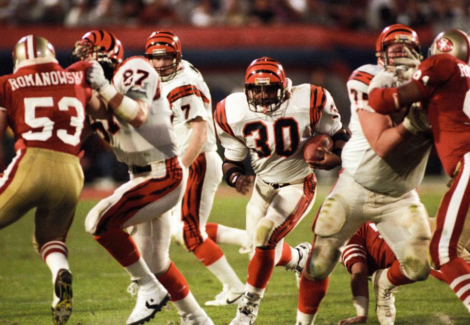 Jan 22, 1989; Miami, FL, USA; FILE PHOTO; Cincinnati Bengals running back Ickey Woods (30) carries the ball against the San Francisco 49ers during Super Bowl XXIII at Joe Robbie Stadium. The 49ers defeated the Bengals 20-16.