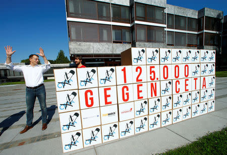 Demonstrators deliver some 125,000 signatures to the Constitutional Court to prostest against the Comprehensive Economic and Trade Agreement (CETA) in Karlsruhe, Germany August 31, 2016. REUTERS/Ralph Orlowski