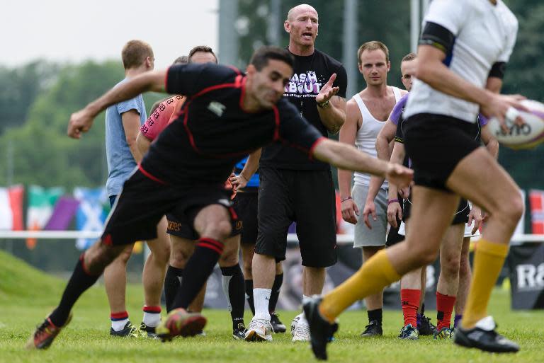 Welsh rugby player Gareth Thomas oversees a training session with members of the Berlin Bruisers on May 23, 2014 in Berlin