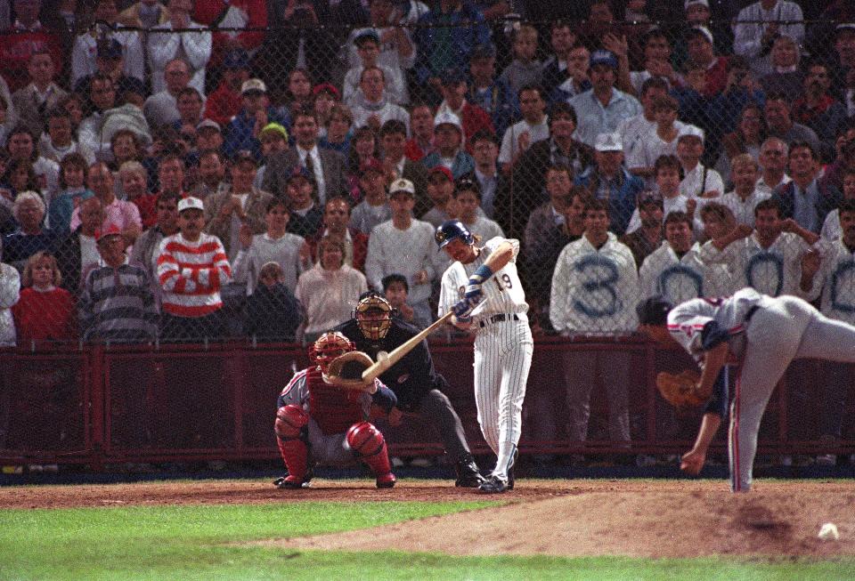 Milwaukee Brewers' Robin Yount gets his career 3,000th hit in the seventh inning against the Cleveland Indians in Milwaukee, Wis., on on Sept. 9, 1992. Indians catcher Junior Ortiz and home plate umpire Rocky Roe look on.