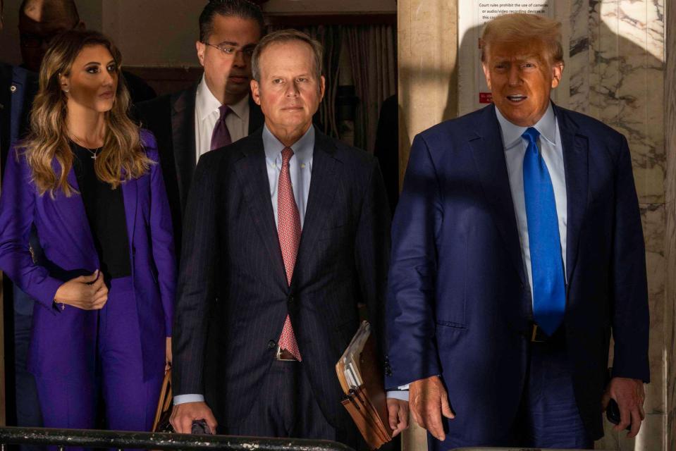 Former President Donald Trump speaks to members of the media as he arrives at New York State Supreme Court where he will face Michael Cohen, who is testifying against him, in New York, on October 24, 2023. Former president Donald Trump returned to his New York civil fraud trial on October 17, 2023 and complained about a partial gag order imposed on him by a judge in a separate case.