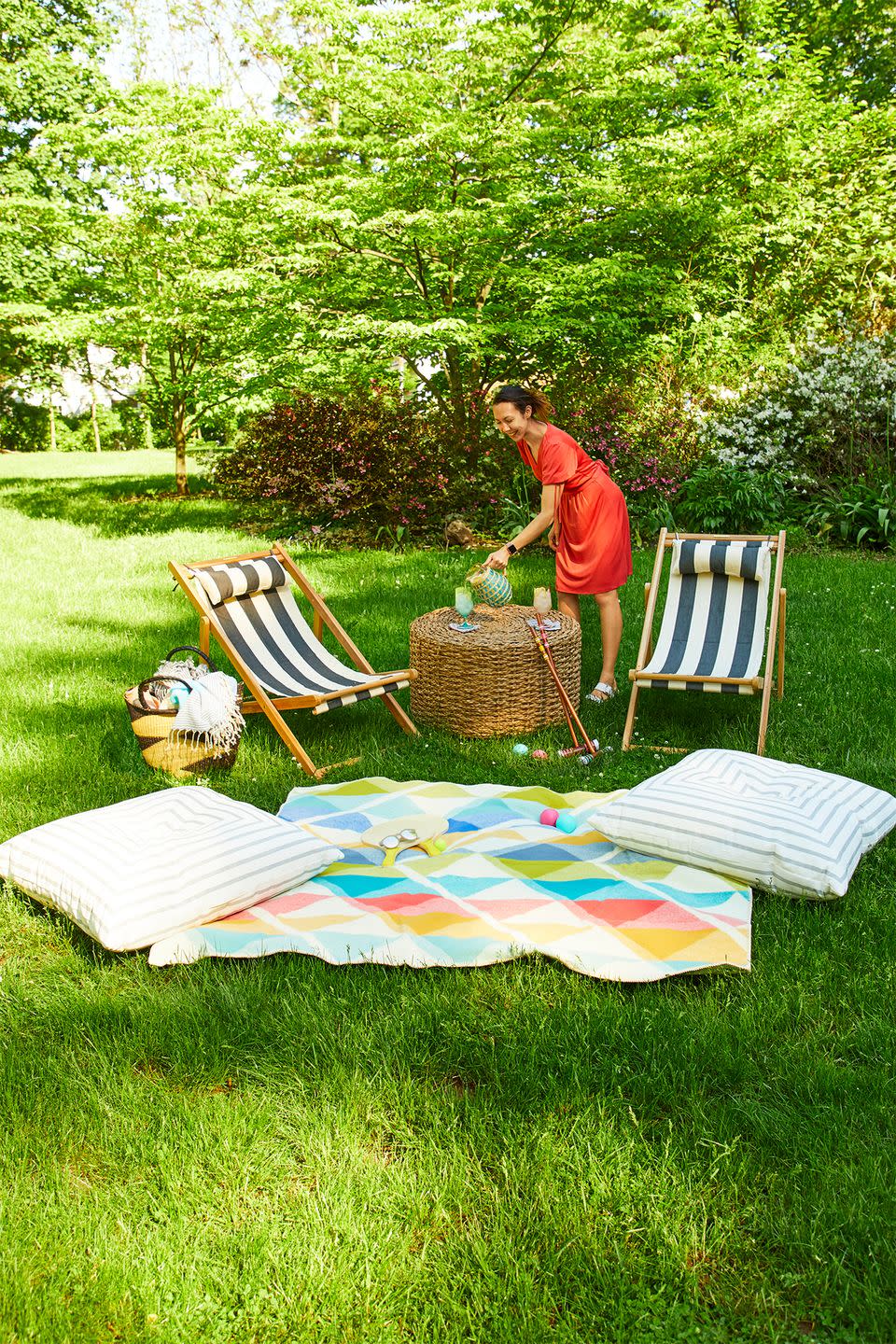 <p>Since lawn furniture may be too bulky to suit the size of your space, go for folding chairs that can be stored easily when they're not in use. For a warm and inviting vibe, throw an outdoor rug and floor pillows on the surrounding grass. </p>