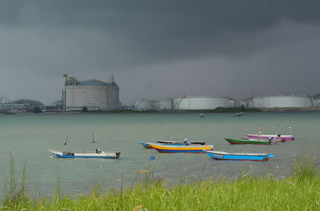 FILE PHOTO: Boats float in front of the VOPAK oil storage terminal in Johor, Malaysia November 7, 2017. REUTERS/Henning Gloystein/File Photo