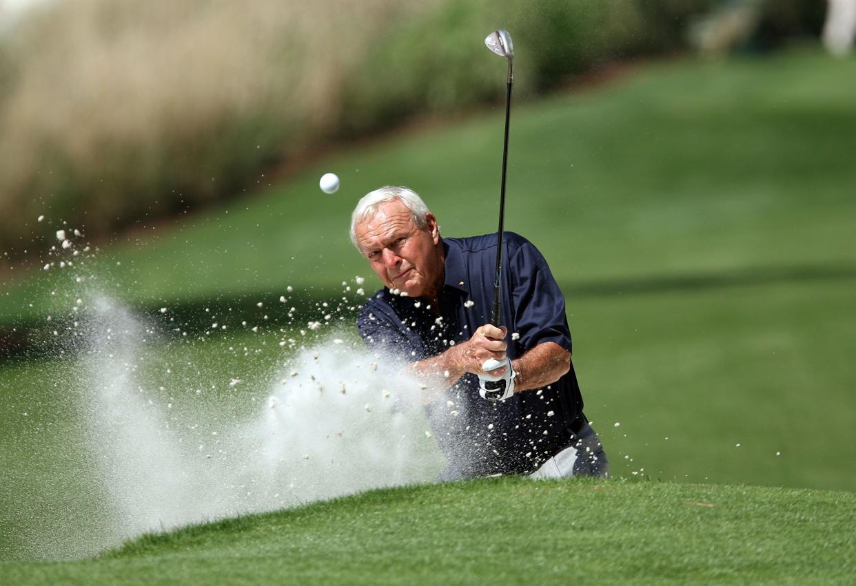 Arnold Palmer hits out a bunker during the Par 3 Contest at the 2008 Masters Tournament at Augusta National Golf Club on April 9, 2008 in Augusta, Georgia.