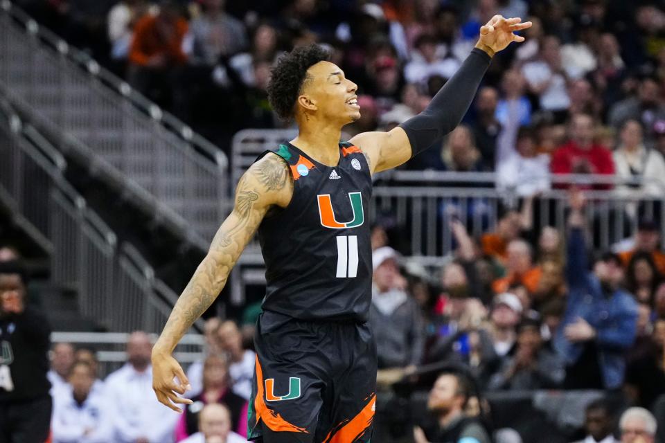 Mar 24, 2023; Kansas City, MO, USA; Miami Hurricanes guard Jordan Miller (11) celebrates after a 3-pointer during the second half of an NCAA tournament Midwest Regional semifinal against the Houston Cougars at T-Mobile Center. Mandatory Credit: Jay Biggerstaff-USA TODAY Sports