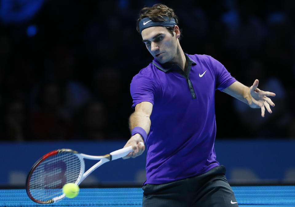 Roger Federer of Switzerland plays a return to Noak Djokovic of Serbia during their ATP World Tour Tennis singles final match in London, Monday, Nov. 12, 2012. (AP Photo/Kirsty Wigglesworth)