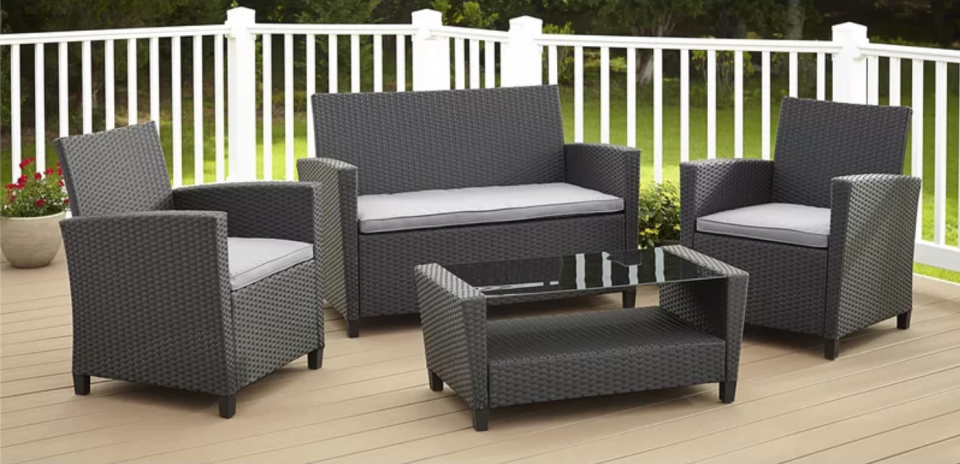 Feltonville 4 Piece Rattan Sofa Seating Group With Cushions. Image via Wayfair.