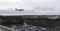 A plane comes in to land at Gatwick Airport in England, Friday, Dec. 21, 2018. Flights resumed at London's Gatwick Airport on Friday morning after drones sparked the shutdown of the airfield for more than 24 hours, leaving tens of thousands of passengers stranded or delayed during the busy holiday season.(AP Photo/Kirsty Wigglesworth)